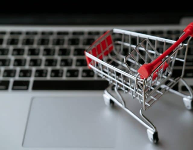 shopping cart on laptop, online shopping concept