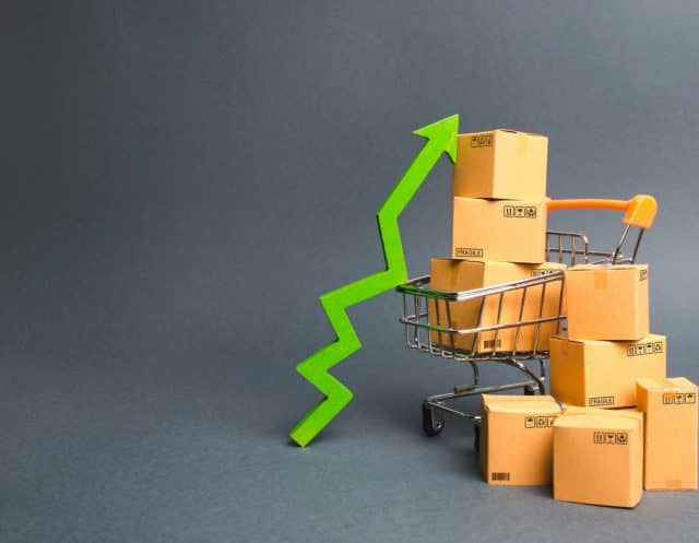 shopping-cart-with-cardboard-boxes-and-a-green-up--6XGWHXS